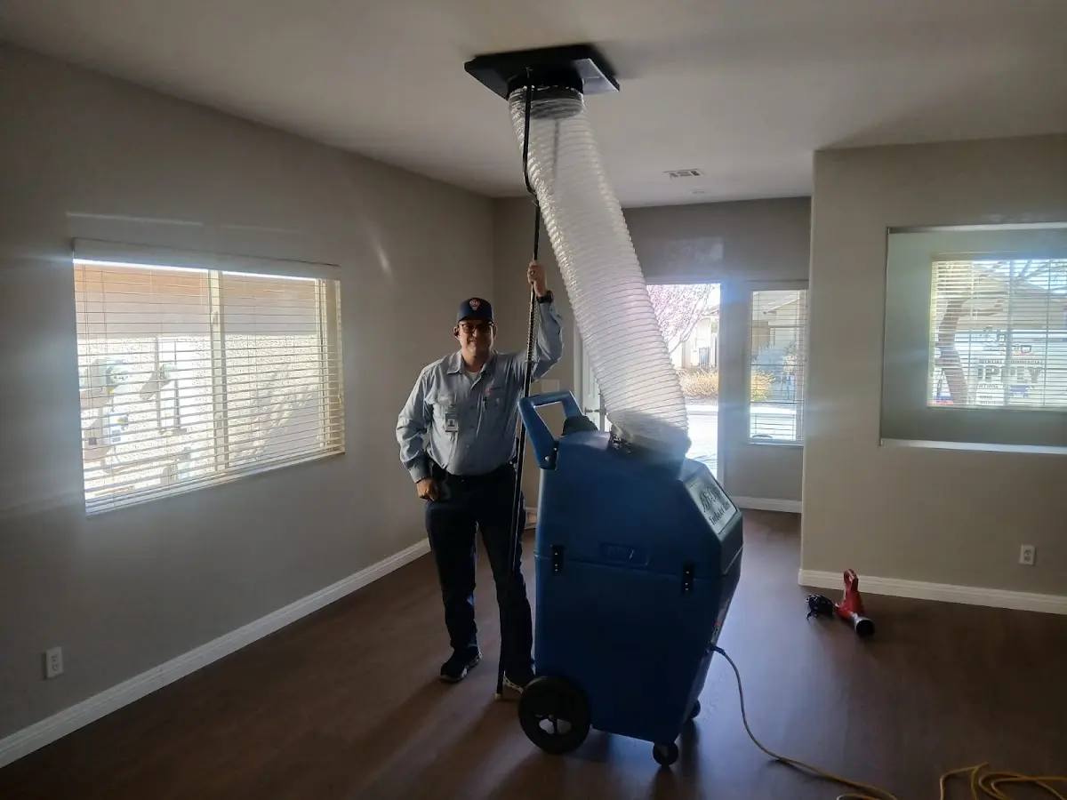 Professional Dryer Vent Cleaning work inside a Baker home